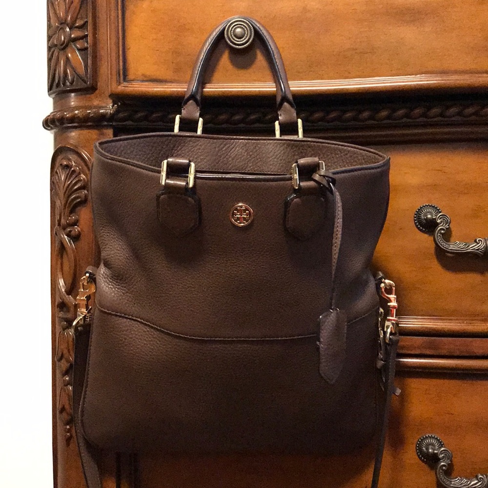 Tory Burch over the shoulder/handbag.